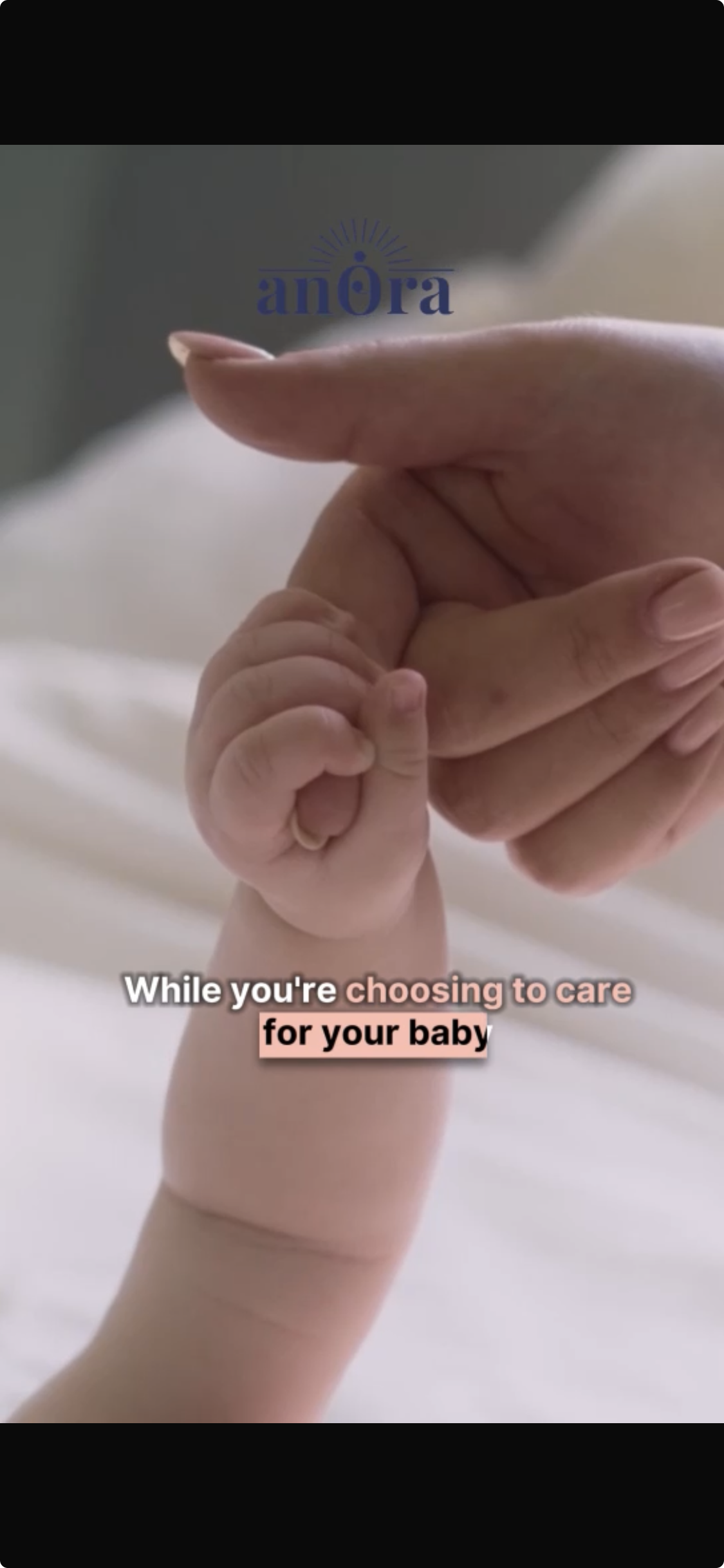 mom holding baby's hand